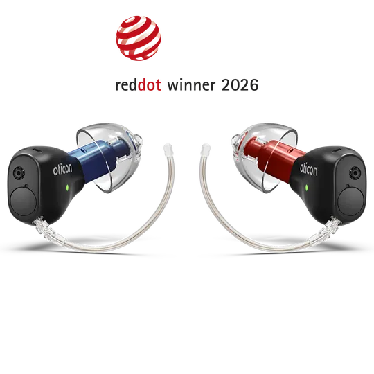 Oticon Zeal hearing aids in blue and red, recognised as a Red Dot winner 2026